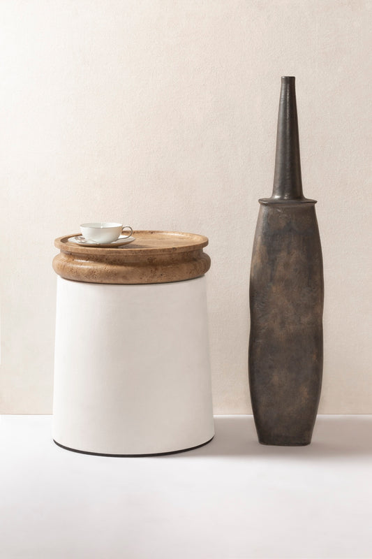 Giobagnara × Stéphane Parmentier Palladio | Side Tables: Suede leather bases with sculptural travertine tops in a selection of natural finishes, merging timeless elegance with modern sensibility | Furniture / Side Tables + Bar Tables | 2Jour Concierge, your luxury lifestyle shop | luxury interiors, hospitality décor, elegant living, boutique hotels, refined lifestyle, yacht décor, office décor, designer furniture