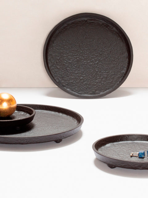 Giobagnara Riace Round Valet Tray | Part of the Riace Imperfect Bronze Bathroom Set | Cast aluminum with burnished bronze finish | A modern and essential design with primal artistry | 2Jour Concierge, your luxury lifestyle shop