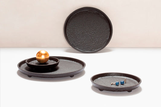Giobagnara Riace Round Valet Tray | Part of the Riace Imperfect Bronze Bathroom Set | Cast aluminum with burnished bronze finish | A modern and essential design with primal artistry | 2Jour Concierge, your luxury lifestyle shop