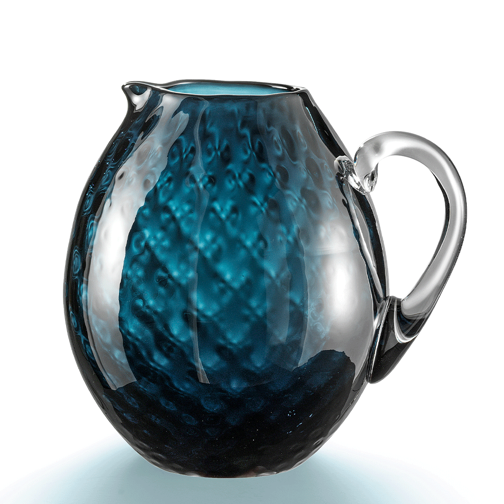NasonMoretti Idra pitcher | Handcrafted Murano glass pitcher with iconic balloton texture | Rounded form with a crystal-clear sculpted handle for elegant pouring | Available in a vivid color palette including avio blue, grey, red, orange, soraya green, and purple | A bold yet refined statement piece for stylish entertaining | Design by NasonMoretti | Tableware & serveware | 2Jour Concierge, your luxury lifestyle shop