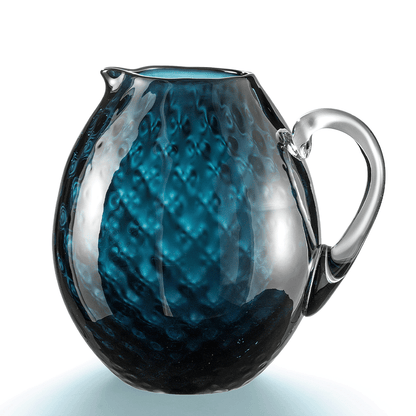 NasonMoretti Idra pitcher | Handcrafted Murano glass pitcher with iconic balloton texture | Rounded form with a crystal-clear sculpted handle for elegant pouring | Available in a vivid color palette including avio blue, grey, red, orange, soraya green, and purple | A bold yet refined statement piece for stylish entertaining | Design by NasonMoretti | Tableware & serveware | 2Jour Concierge, your luxury lifestyle shop