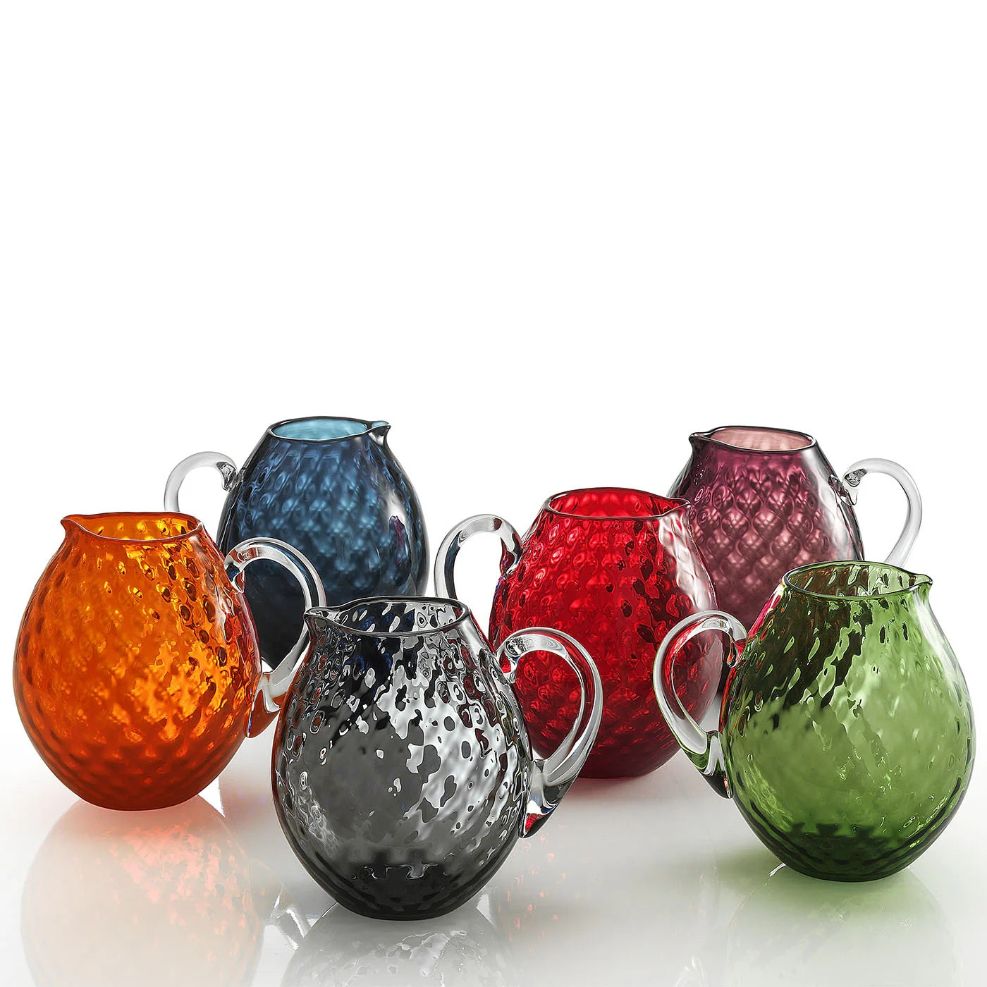 NasonMoretti Idra carafe | Handcrafted Murano glass jug with elegant balloton texture | Rounded silhouette with a sculpted clear handle, blending tradition with bold color | Available in a vibrant palette including avio blue, grey, red, orange, soraya green, and purple | A striking yet functional centerpiece for any refined table setting | Design by NasonMoretti | Tableware & serveware | 2Jour Concierge, your luxury lifestyle shop