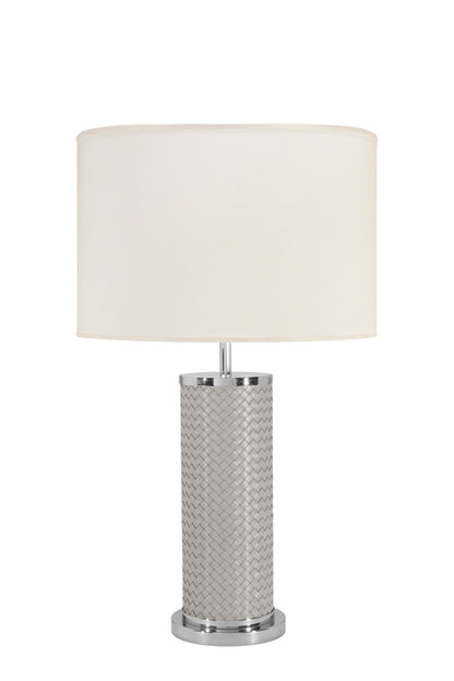 Riviere Flavia | Table Lamp: Leather-covered cylindrical base with optional braided, handwoven, or herringbone patterns, chrome or gold metal finishes, designed for refined contemporary interiors | Lighting / Table Lamps | 2Jour Concierge, your luxury lifestyle shop | luxury interiors, hospitality décor, elegant living, designer lighting, boutique hotels, refined lifestyle, yacht décor