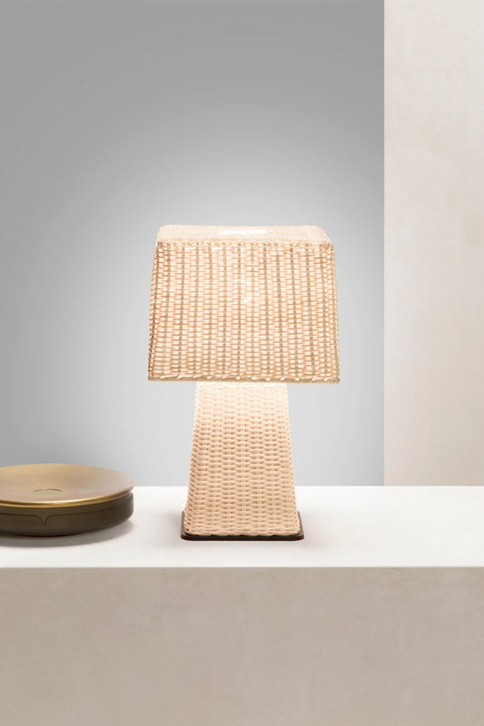 Giobagnara x Stéphane Parmentier Eolie Table Lamp | Meticulously Handmade Woven Rattan | Effortlessly Elegant Design with Pure Forms and Proportions | Rattan Features Warm Natural Nuances and Captivating Light and Dark Effects | Metal Base Provides Subtle Contrast and Texture | Harmonious Combination of Materials for Timeless Appeal