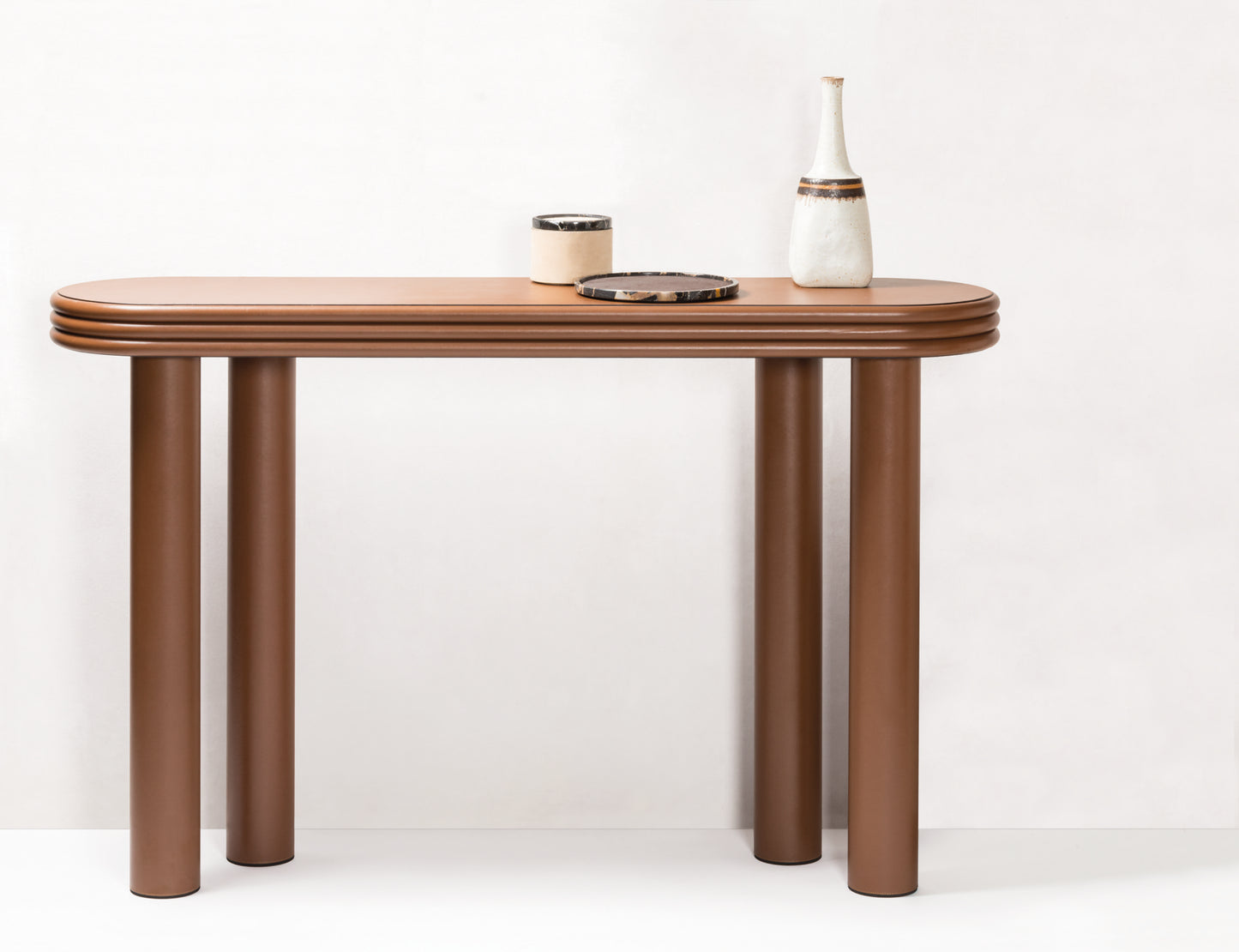 Giobagnara × Stéphane Parmentier Scala | Leather Console: Minimalist design with stacked edges and cylindrical legs | Furniture / Console Tables + Étagères | 2Jour Concierge, your luxury lifestyle shop | contemporary interiors, luxury design, refined craftsmanship, Italian furniture, architectural décor