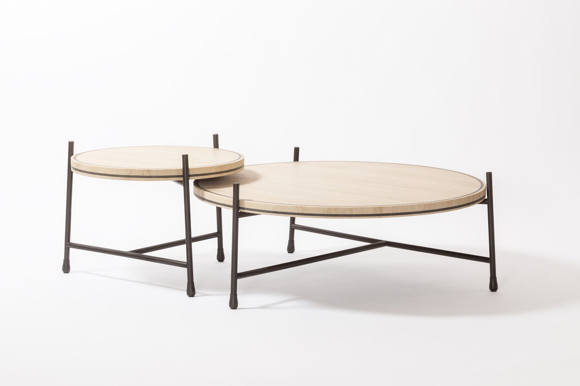 Giobagnara × Stéphane Parmentier Oblivion | Round Travertine Coffee Table: Travertine top with slim metal legs in bronze or white, available in classic or titanium finishes | Furniture / Coffee Tables | 2Jour Concierge, your luxury lifestyle shop | luxury interiors, elegant living, hospitality décor, boutique hotels, yacht décor, executive offices, refined lifestyle