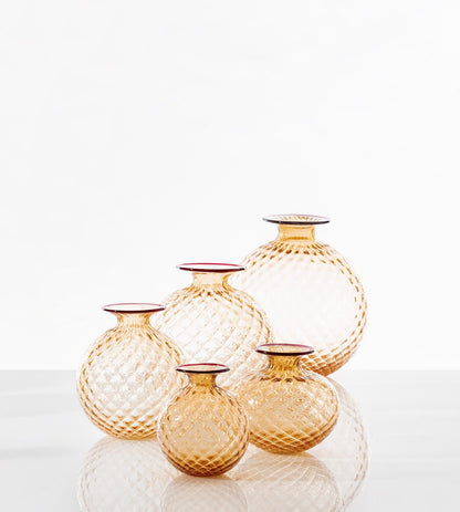 Monofiori Balloton Vase by Venini | Small blown glass vials resembling ancient treasures, delicately crafted with caps and curious floret-like details | Murano glass | Available in matte transparent or glossy transparent finishes | Home Decor Vases | 2Jour Concierge, your luxury lifestyle shop