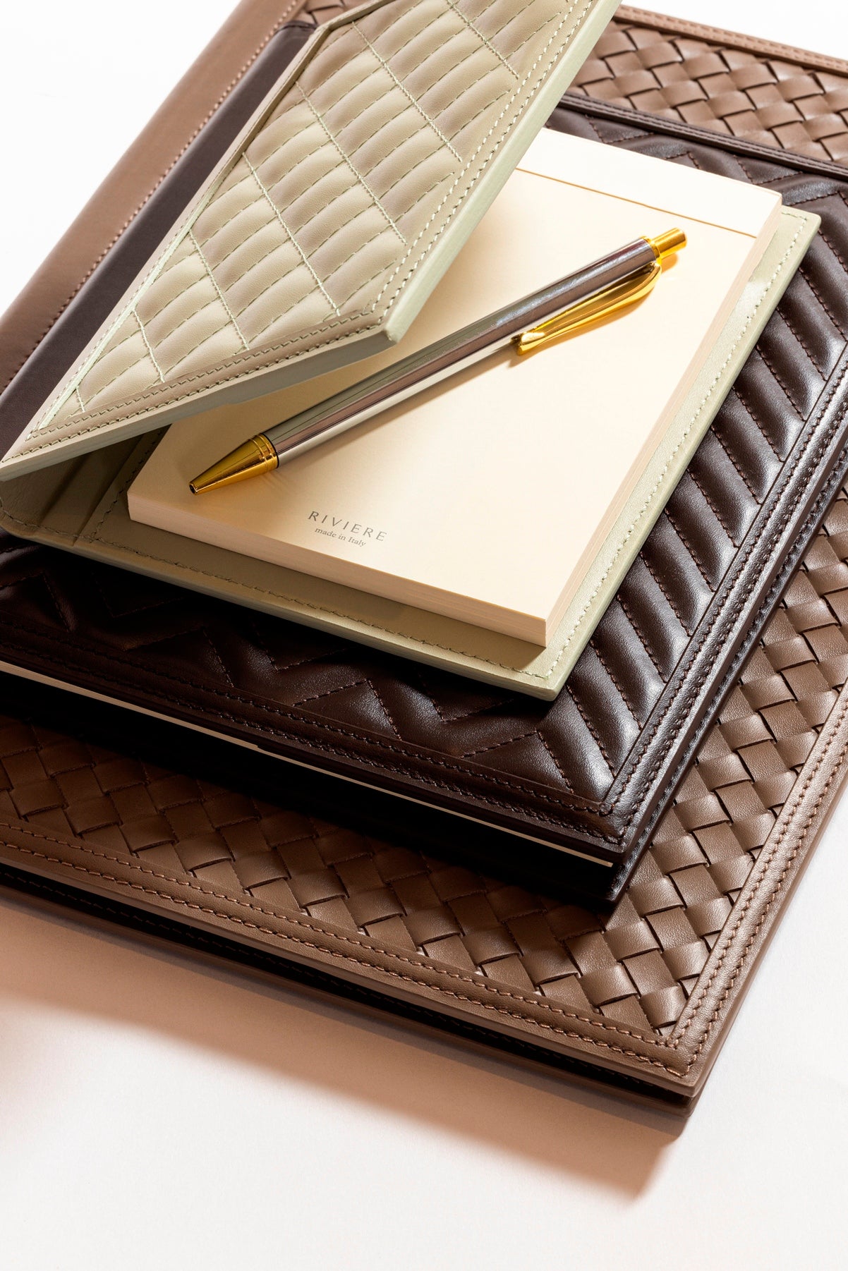 Rivière Handwoven Notepad Holder | Leather notepad holder featuring a padded handwoven pattern with a side pencil holder and pen | Includes a notepad made of 70 ivory paper sheets | Available in small (A6), medium (A5), and large (A4) sizes | Office Accessories | 2Jour Concierge, your luxury lifestyle shop