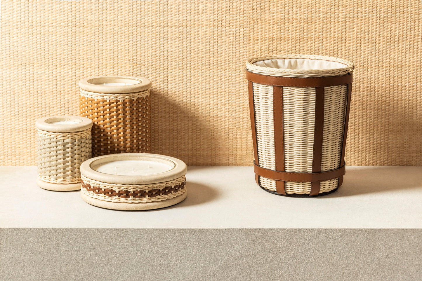 Pigment France × Giobagnara Courbet Travertine Candle Holder (Regular) | Marble candle holder with woven leather and rattan covering, complete with removable wax candle | Décor / Vases + Candle Holders | 2Jour Concierge, your luxury lifestyle shop | luxury interiors, refined lifestyle, hospitality décor, designer home accessories, boutique hotels, yacht décor, elegant living, office décor