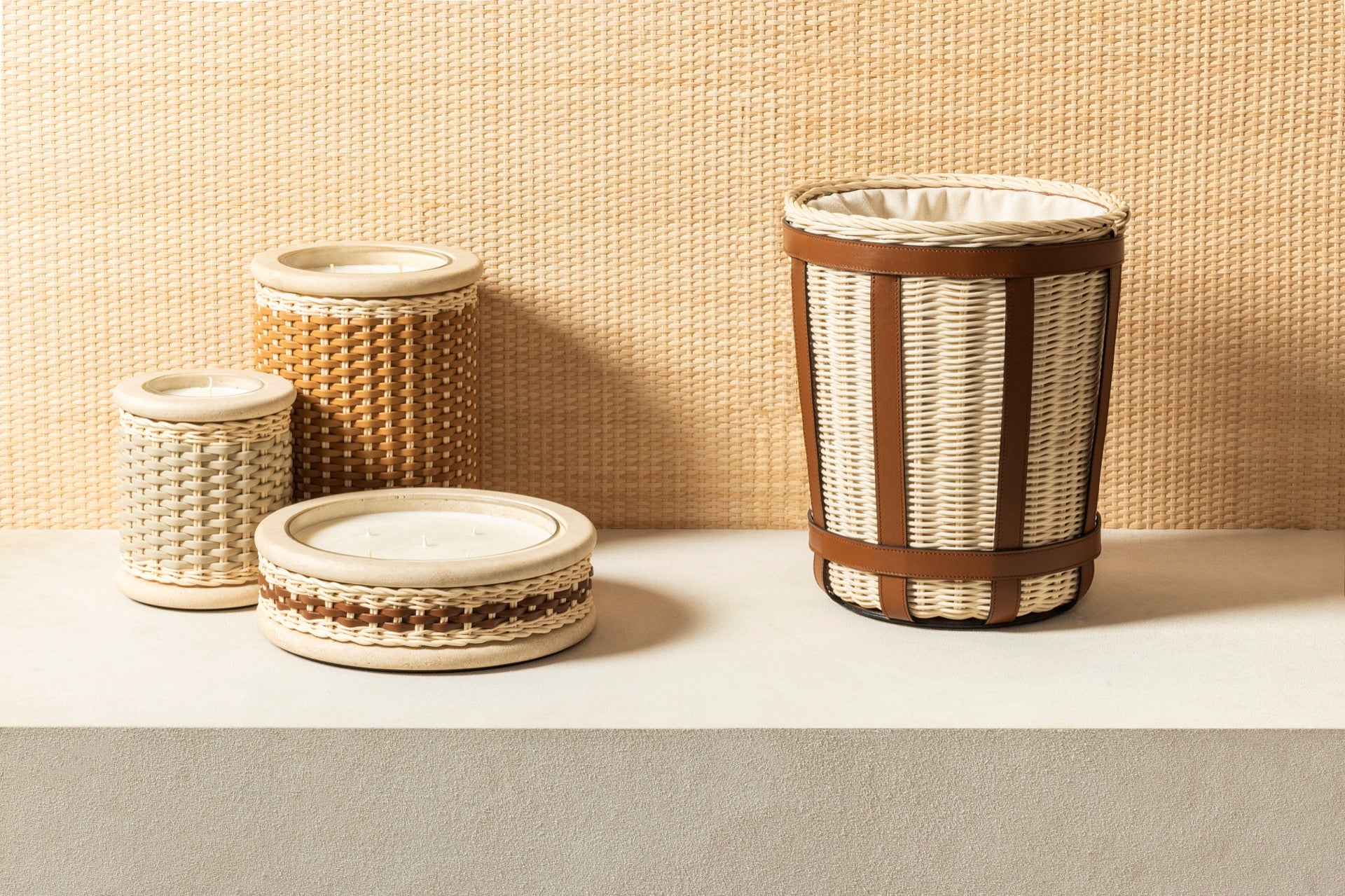Pigment France × Giobagnara Courbet Travertine Candle Holder (Regular) | Marble candle holder with woven leather and rattan covering, complete with removable wax candle | Décor / Vases + Candle Holders | 2Jour Concierge, your luxury lifestyle shop | luxury interiors, refined lifestyle, hospitality décor, designer home accessories, boutique hotels, yacht décor, elegant living, office décor