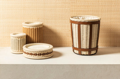 Pigment France × Giobagnara Courbet Travertine Candle Holder (Regular) | Marble candle holder with woven leather and rattan covering, complete with removable wax candle | Décor / Vases + Candle Holders | 2Jour Concierge, your luxury lifestyle shop | luxury interiors, refined lifestyle, hospitality décor, designer home accessories, boutique hotels, yacht décor, elegant living, office décor