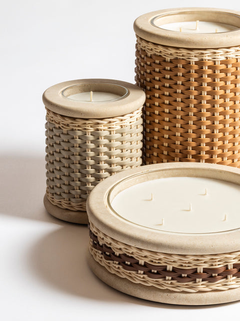 Pigment France × Giobagnara Courbet Travertine Candle Holder (Regular) | Marble candle holder with woven leather and rattan covering, complete with removable wax candle | Décor / Vases + Candle Holders | 2Jour Concierge, your luxury lifestyle shop | luxury interiors, refined lifestyle, hospitality décor, designer home accessories, boutique hotels, yacht décor, elegant living, office décor