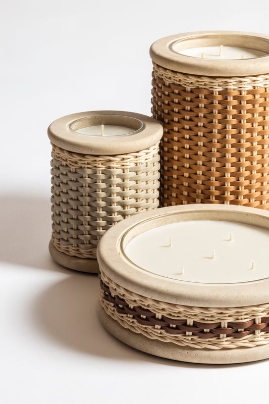 Pigment France × Giobagnara Courbet Travertine Candle Holder (Regular) | Marble candle holder with woven leather and rattan covering, complete with removable wax candle | Décor / Vases + Candle Holders | 2Jour Concierge, your luxury lifestyle shop | luxury interiors, refined lifestyle, hospitality décor, designer home accessories, boutique hotels, yacht décor, elegant living, office décor