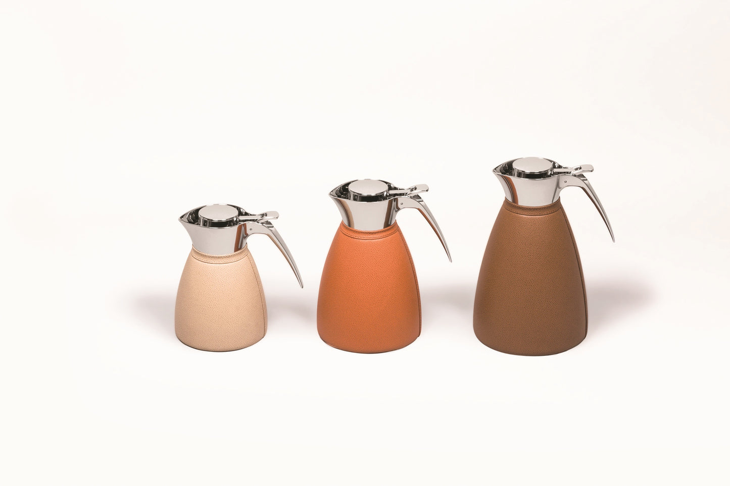 Vincennes Carafe by Pigment France | Partially leather-covered insulated stainless steel carafe with chrome-plated finish. Two-chamber structure maintains liquid temperatures. Precise pouring with specially developed hinged lid for one-hand operation. | Tableware and Drinkware | 2Jour Concierge, your luxury lifestyle shop