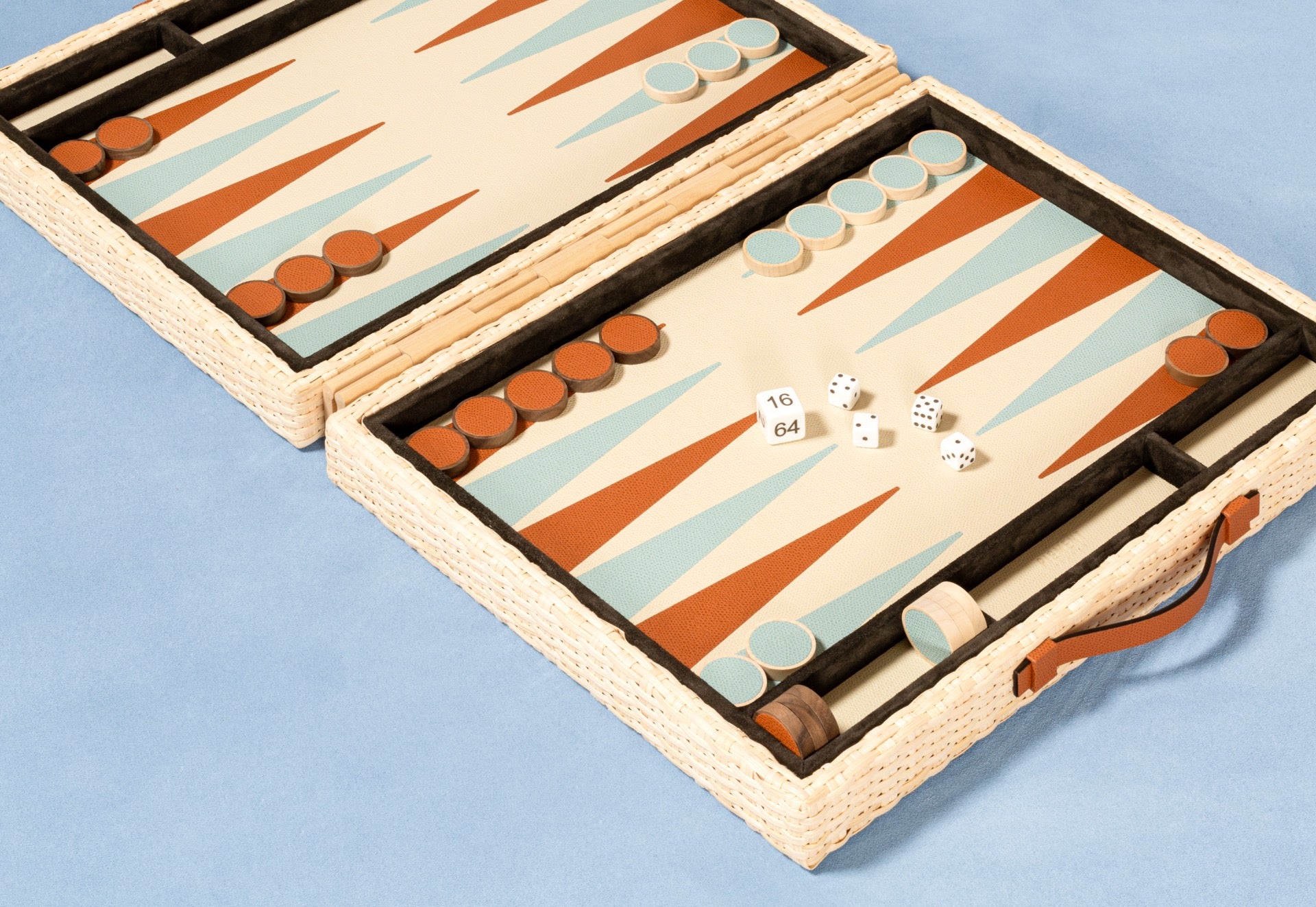 Pigment France Monte-Carlo Backgammon Case | Luxury backgammon set in woven rattan with leather details and inlaid playing surface | Games / Backgammon Sets | 2Jour Concierge, your luxury lifestyle shop | luxury interiors, hospitality décor, refined lifestyle, designer home accessories, boutique hotels, yacht décor, executive interiors, elegant living
