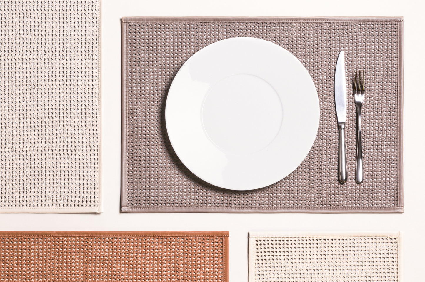 Pascale Plaited Leather Placemat by Pigment France | Handcrafted from finely cut and folded nappa strips using a weaving technique | Tableware and Dining Accessories | 2Jour Concierge, your luxury lifestyle shop