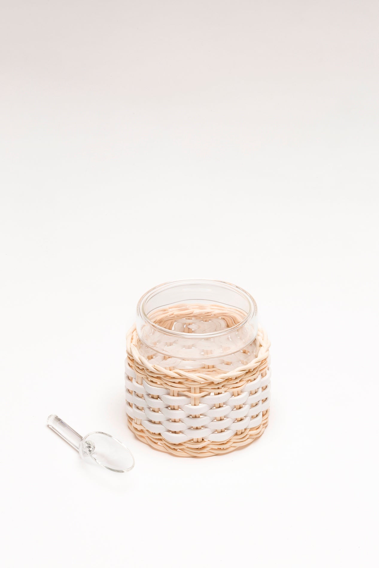 Deauville Leather & Rattan Glass Sugar Bowl with Spoon by Pigment France | Transparent borosilicate glass partially dressed in woven leather and rattan | Includes a glass lid and spoon | Home Decor and Serveware | 2Jour Concierge, your luxury lifestyle shop