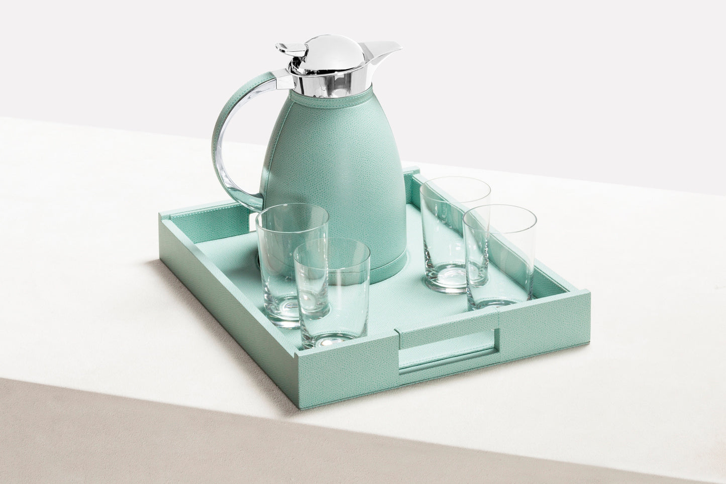 Pigment France Beaubourg Nesting Tray Set | Includes a large Beaubourg tray with spaces to securely host four fine crystal glasses and one carafe | Compatible with the following 1.0L carafes: Chantilly, Villandry, Monceau, Vincennes | Carafes: Partially leather-covered insulated stainless steel with chrome-plated finish | Beaubourg Tray: Leather-covered wood structure | Elegant and stable design | Home Decor and Serveware | 2Jour Concierge, your luxury lifestyle shop