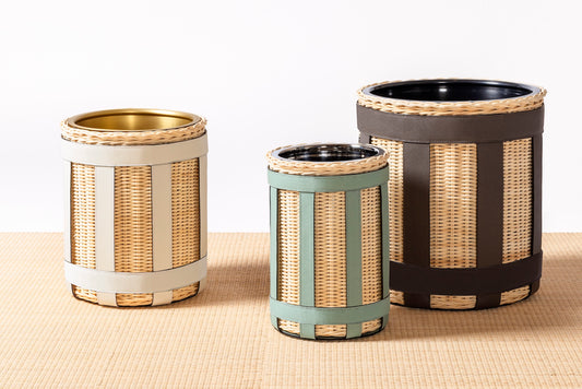 Pigment France × Gio Minelli Sillon Bin | Storage bin in natural rattan with leather trim and polished chrome, bronze or brass finish | Storage / Bins | 2Jour Concierge, your luxury lifestyle shop | luxury interiors, hospitality décor, designer home accessories, boutique hotels, refined lifestyle, yacht décor, office décor, executive interiors