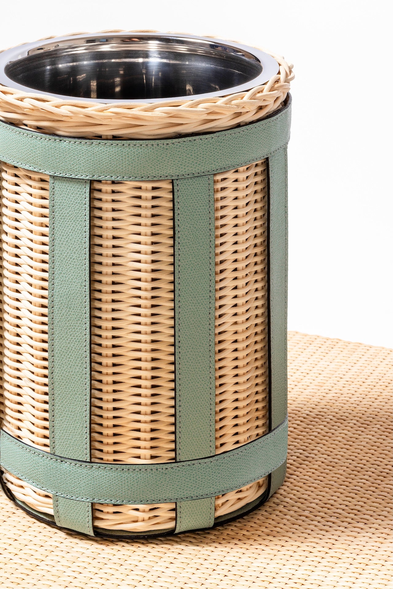 Pigment France × Gio Minelli Sillon Bin | Storage bin in natural rattan with leather trim and polished chrome, bronze or brass finish | Storage / Bins | 2Jour Concierge, your luxury lifestyle shop | luxury interiors, hospitality décor, designer home accessories, boutique hotels, refined lifestyle, yacht décor, office décor, executive interiors