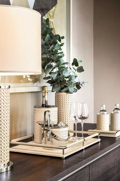 Riviere Flavia | Table Lamp: Leather-covered cylindrical base with optional braided, handwoven, or herringbone patterns, chrome or gold metal finishes, designed for refined contemporary interiors | Lighting / Table Lamps | 2Jour Concierge, your luxury lifestyle shop | luxury interiors, hospitality décor, elegant living, designer lighting, boutique hotels, refined lifestyle, yacht décor