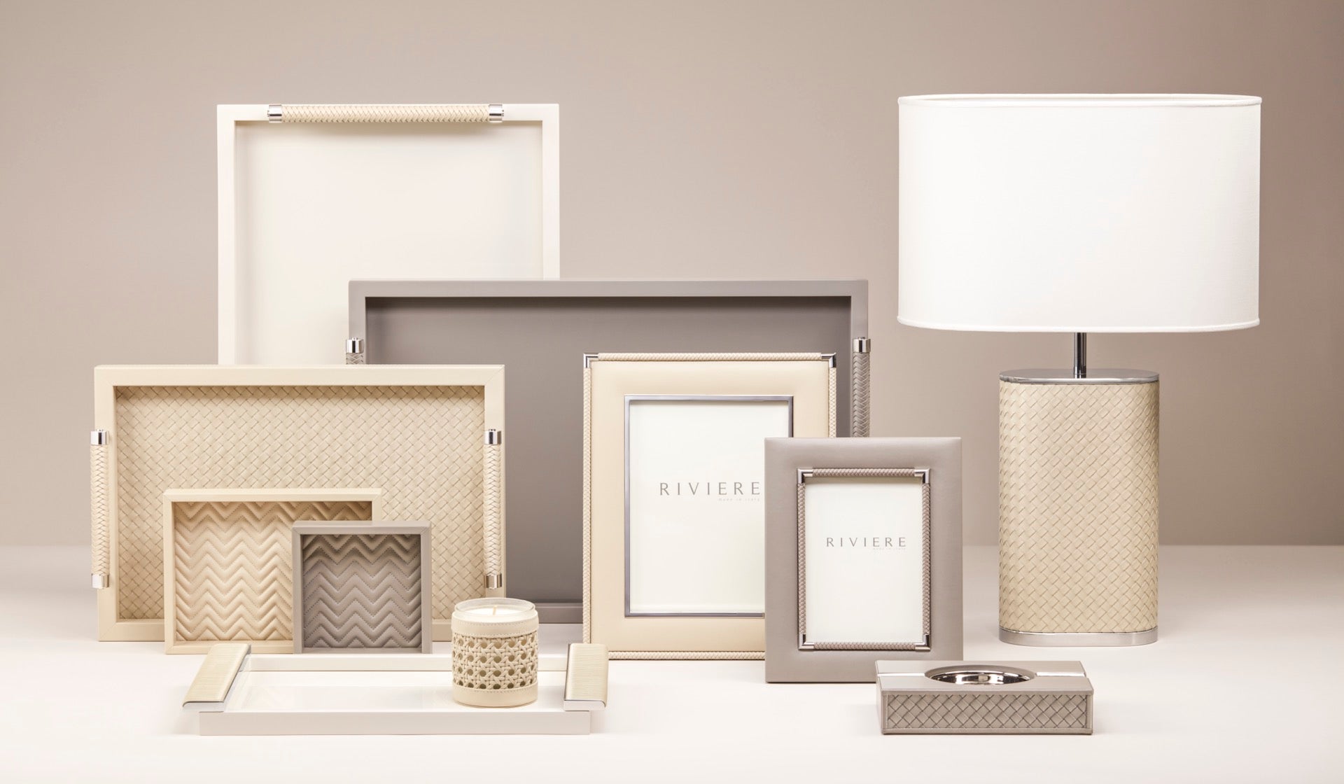 Riviere Livia Handwoven | Table Lamp: Oval lamp with handwoven leather structure, chrome or gold metal details, and oval shade, designed for sophisticated living spaces | Lighting / Table Lamps | 2Jour Concierge, your luxury lifestyle shop | luxury interiors, hospitality décor, elegant living, designer lighting, boutique hotels, refined lifestyle, yacht décor