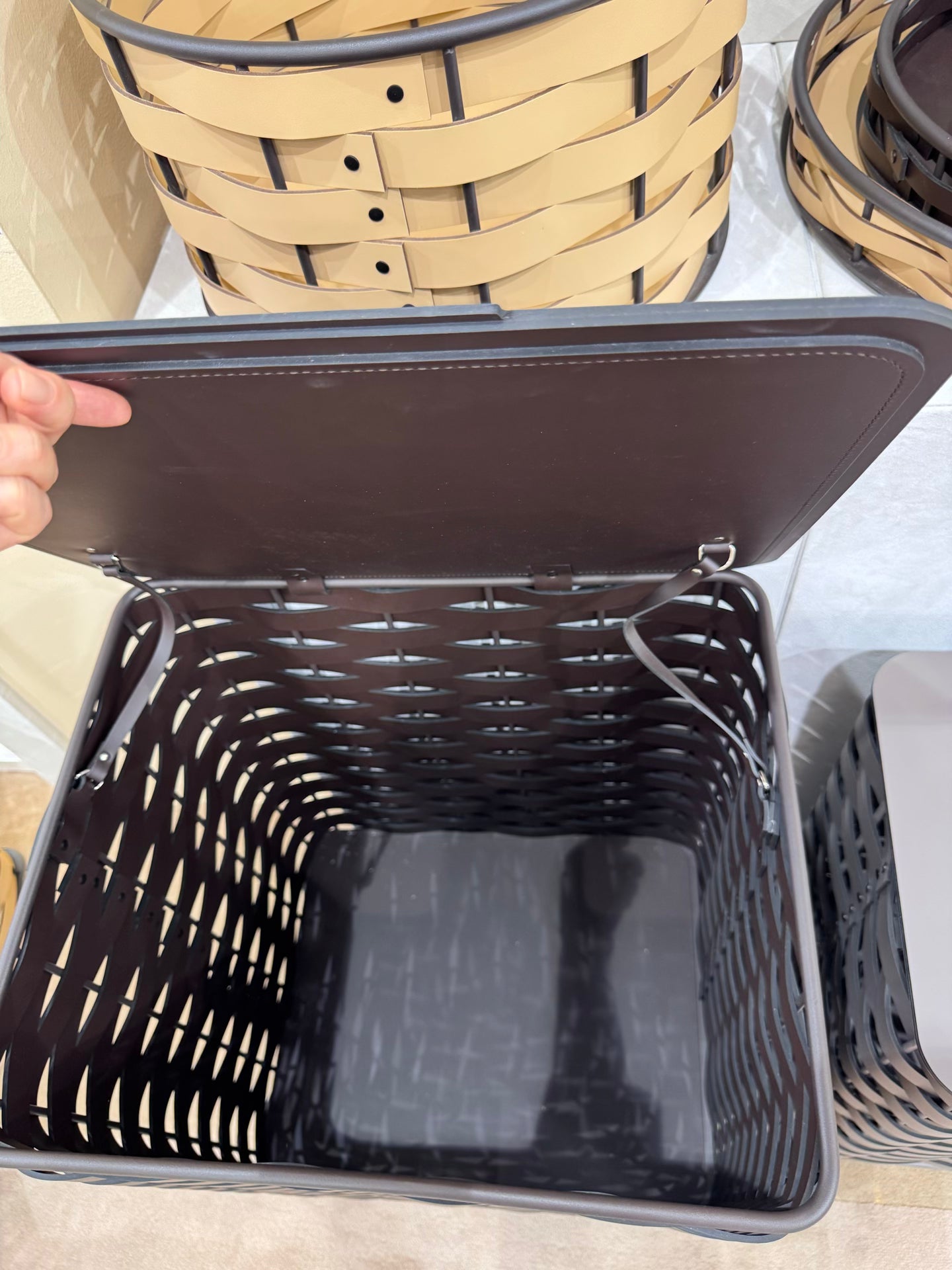 Rudi | Nassa Regular Laundry Basket: Dark-stained aluminum structure with Tecnocuoio® weaving — two sizes with or without lid, rubber feet or wheels | Storage | 2Jour Concierge, your luxury lifestyle shop | luxury laundry basket, Rudi Nassa, Tecnocuoio basket, designer laundry hamper, indoor outdoor basket