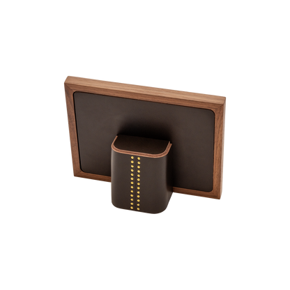 Rabitti 1969 | Toiles de Noyer Walnut Wood and Saddle Leather Picture Frame N°1: Walnut wood picture frame with saddle leather inserts and golden tacks, two sizes, magnetic back | Decor | 2Jour Concierge, your luxury lifestyle shop | luxury picture frame, Rabitti 1969, Toiles de Noyer, walnut leather frame, golden tack detail, Italian luxury decor, designer photo frame, Giobagnara leather frame
