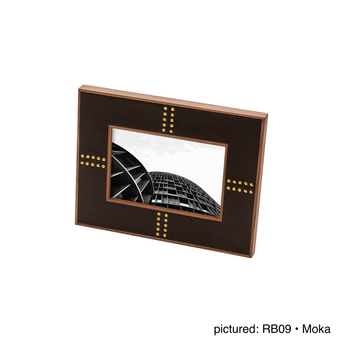 Rabitti 1969 | Toiles de Noyer Walnut Wood and Saddle Leather Picture Frame N°1: Walnut wood picture frame with saddle leather inserts and golden tacks, two sizes, magnetic back | Decor | 2Jour Concierge, your luxury lifestyle shop | luxury picture frame, Rabitti 1969, Toiles de Noyer, walnut leather frame, golden tack detail, Italian luxury decor, designer photo frame, Giobagnara leather frame
