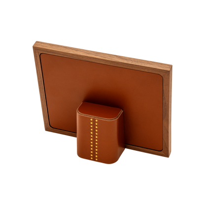 Rabitti 1969 | Toiles de Noyer Walnut Wood and Saddle Leather Picture Frame N°1: Walnut wood picture frame with saddle leather inserts and golden tacks, two sizes, magnetic back | Decor | 2Jour Concierge, your luxury lifestyle shop | luxury picture frame, Rabitti 1969, Toiles de Noyer, walnut leather frame, golden tack detail, Italian luxury decor, designer photo frame, Giobagnara leather frame