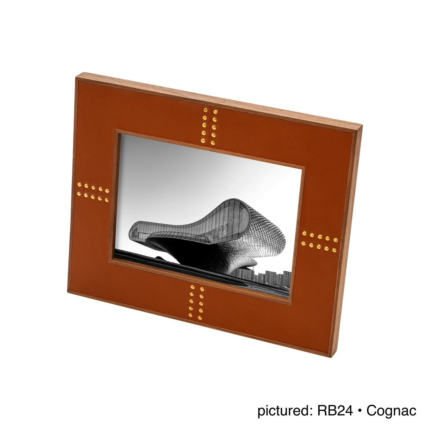 Rabitti 1969 | Toiles de Noyer Walnut Wood and Saddle Leather Picture Frame N°1: Walnut wood picture frame with saddle leather inserts and golden tacks, two sizes, magnetic back | Decor | 2Jour Concierge, your luxury lifestyle shop | luxury picture frame, Rabitti 1969, Toiles de Noyer, walnut leather frame, golden tack detail, Italian luxury decor, designer photo frame, Giobagnara leather frame