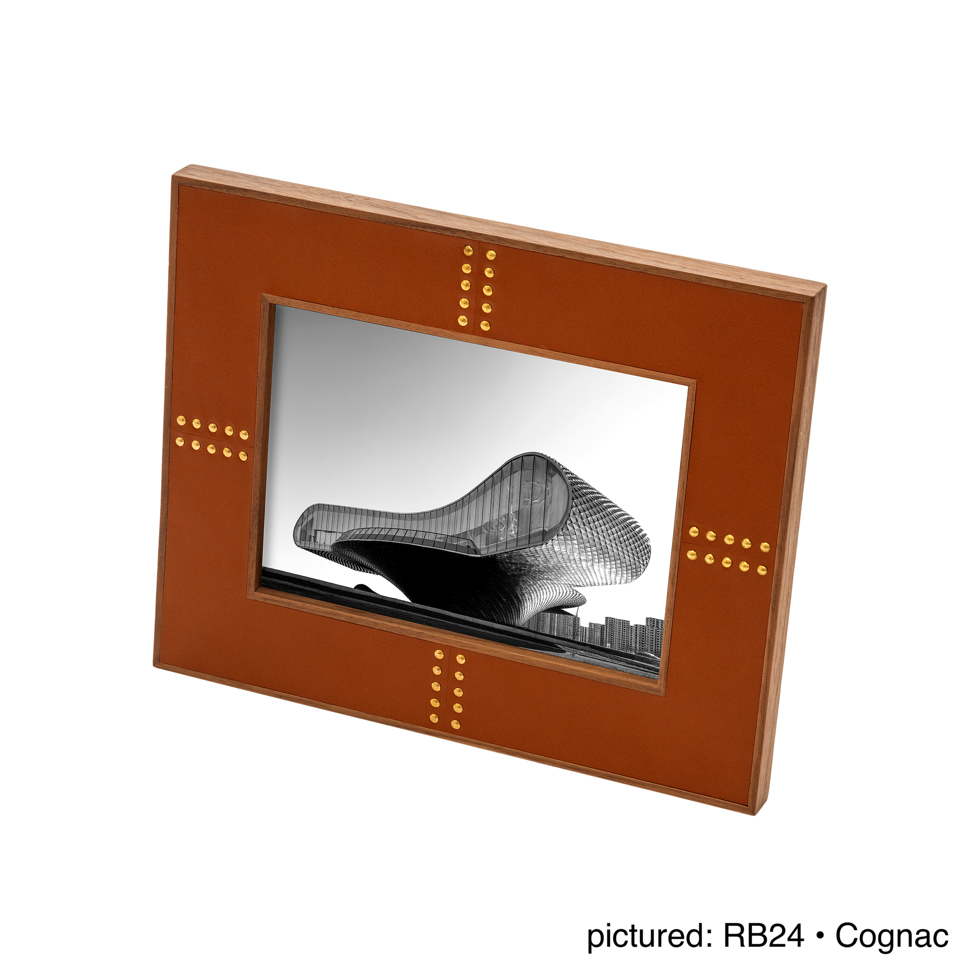 Rabitti 1969 | Toiles de Noyer Walnut Wood and Saddle Leather Picture Frame N°1: Walnut wood picture frame with saddle leather inserts and golden tacks, two sizes, magnetic back | Decor | 2Jour Concierge, your luxury lifestyle shop | luxury picture frame, Rabitti 1969, Toiles de Noyer, walnut leather frame, golden tack detail, Italian luxury decor, designer photo frame, Giobagnara leather frame