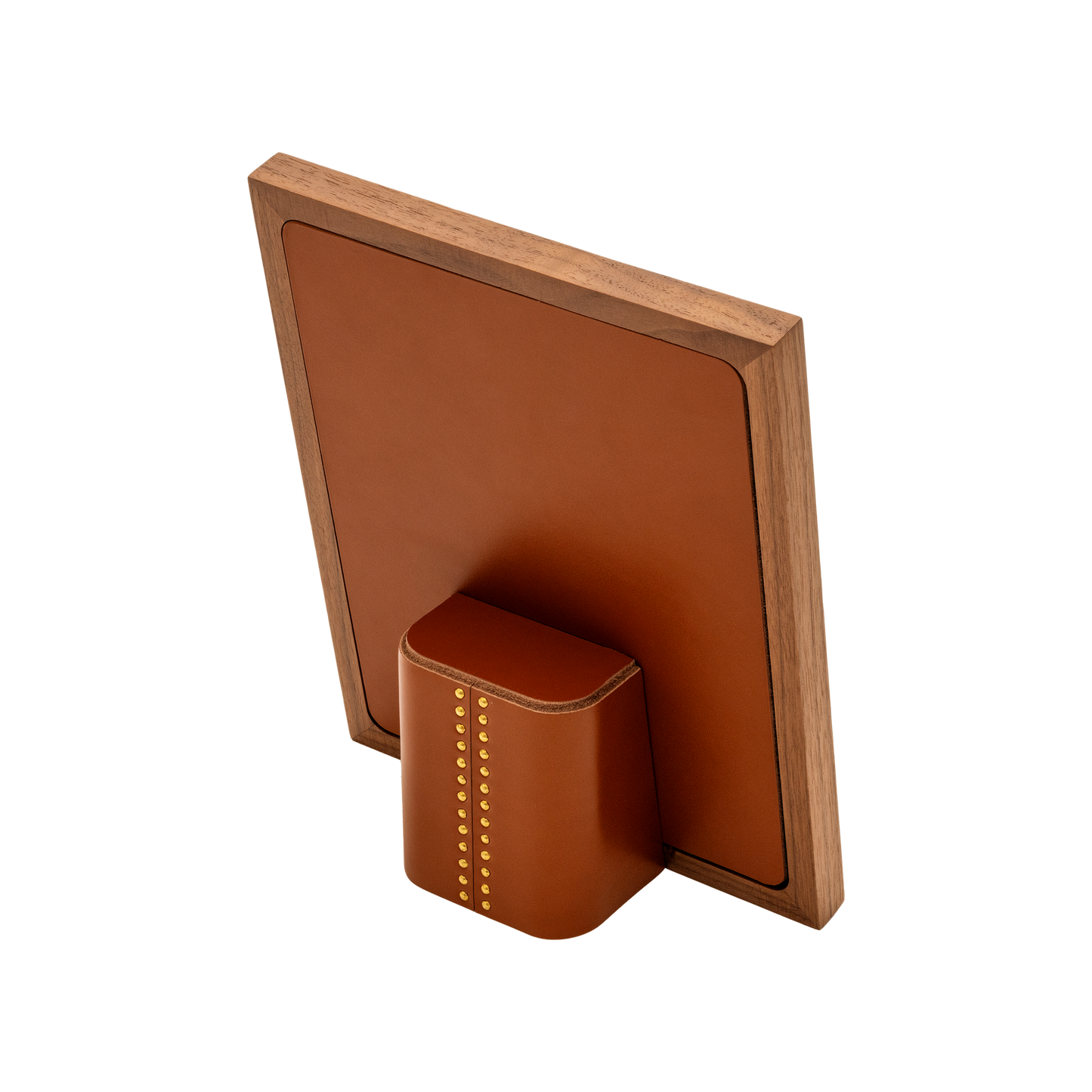 Rabitti 1969 | Toiles de Noyer Walnut Wood and Saddle Leather Picture Frame N°1: Walnut wood picture frame with saddle leather inserts and golden tacks, two sizes, magnetic back | Decor | 2Jour Concierge, your luxury lifestyle shop | luxury picture frame, Rabitti 1969, Toiles de Noyer, walnut leather frame, golden tack detail, Italian luxury decor, designer photo frame, Giobagnara leather frame