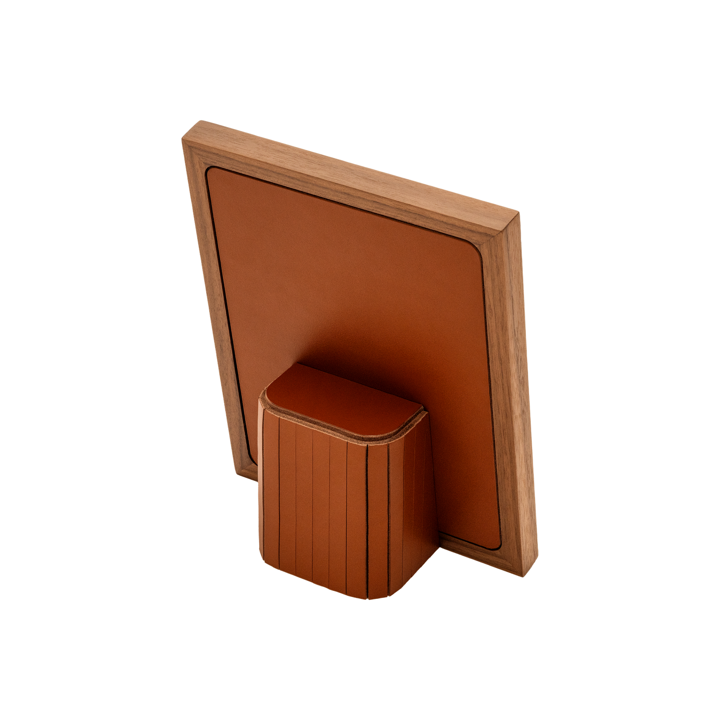 Rabitti 1969 | Toiles de Noyer Walnut Wood and Saddle Leather Picture Frame N°2: Walnut wood picture frame with saddle leather inserts engraved with vertical and horizontal stripes, two sizes, magnetic back | Decor | 2Jour Concierge, your luxury lifestyle shop | luxury picture frame, Rabitti 1969, Toiles de Noyer, walnut leather frame, engraved leather detail, Italian luxury decor, designer photo frame, Giobagnara leather frame
