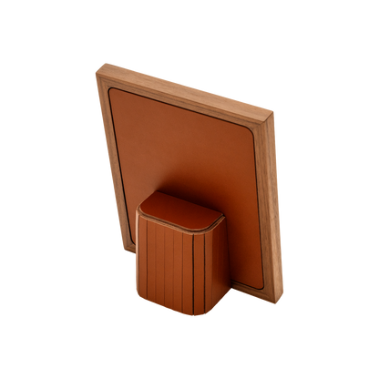 Rabitti 1969 | Toiles de Noyer Walnut Wood and Saddle Leather Picture Frame N°2: Walnut wood picture frame with saddle leather inserts engraved with vertical and horizontal stripes, two sizes, magnetic back | Decor | 2Jour Concierge, your luxury lifestyle shop | luxury picture frame, Rabitti 1969, Toiles de Noyer, walnut leather frame, engraved leather detail, Italian luxury decor, designer photo frame, Giobagnara leather frame