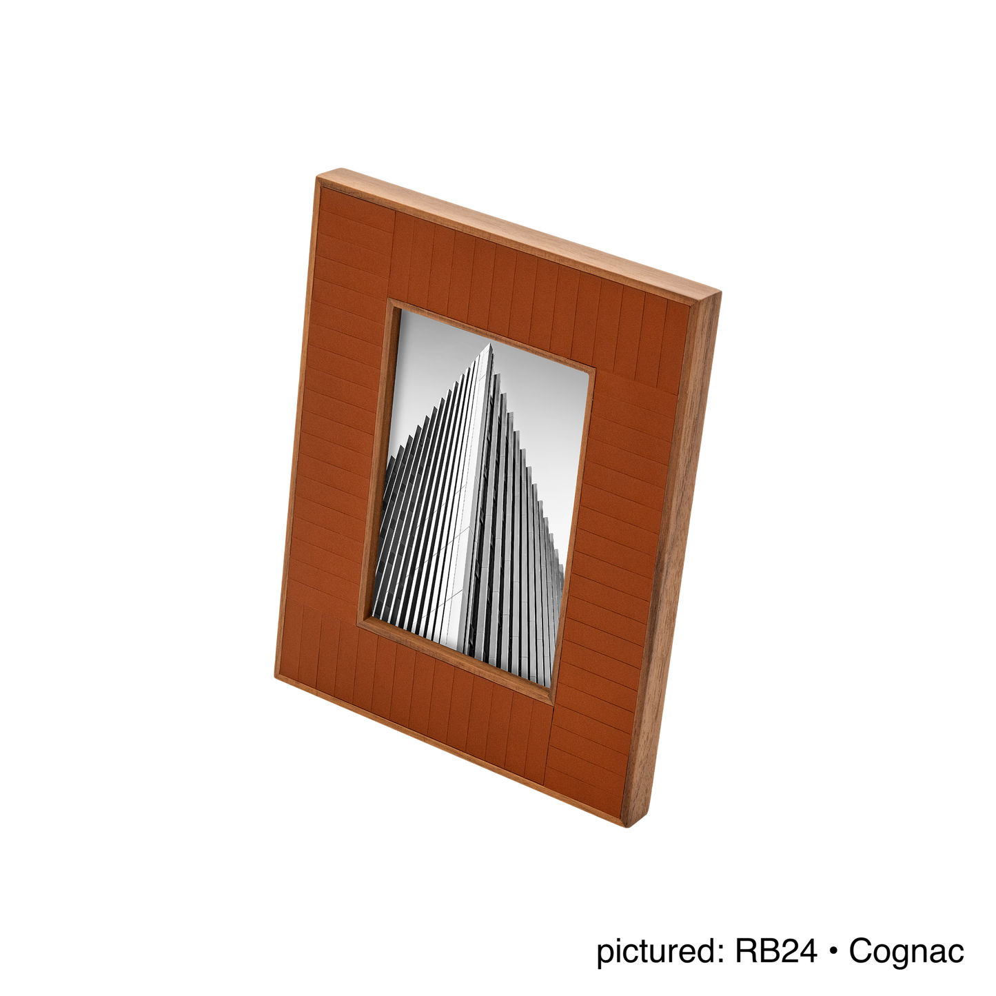 Rabitti 1969 | Toiles de Noyer Walnut Wood and Saddle Leather Picture Frame N°2: Walnut wood picture frame with saddle leather inserts engraved with vertical and horizontal stripes, two sizes, magnetic back | Decor | 2Jour Concierge, your luxury lifestyle shop | luxury picture frame, Rabitti 1969, Toiles de Noyer, walnut leather frame, engraved leather detail, Italian luxury decor, designer photo frame, Giobagnara leather frame