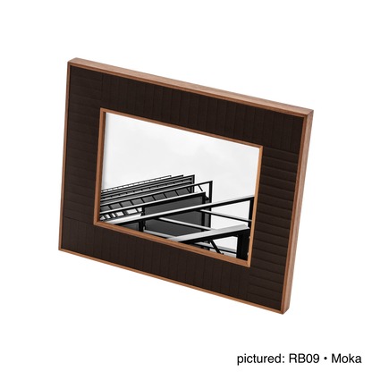 Rabitti 1969 | Toiles de Noyer Walnut Wood and Saddle Leather Picture Frame N°2: Walnut wood picture frame with saddle leather inserts engraved with vertical and horizontal stripes, two sizes, magnetic back | Decor | 2Jour Concierge, your luxury lifestyle shop | luxury picture frame, Rabitti 1969, Toiles de Noyer, walnut leather frame, engraved leather detail, Italian luxury decor, designer photo frame, Giobagnara leather frame