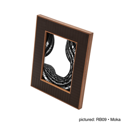 Rabitti 1969 | Toiles de Noyer Walnut Wood and Saddle Leather Picture Frame N°2: Walnut wood picture frame with saddle leather inserts engraved with vertical and horizontal stripes, two sizes, magnetic back | Decor | 2Jour Concierge, your luxury lifestyle shop | luxury picture frame, Rabitti 1969, Toiles de Noyer, walnut leather frame, engraved leather detail, Italian luxury decor, designer photo frame, Giobagnara leather frame