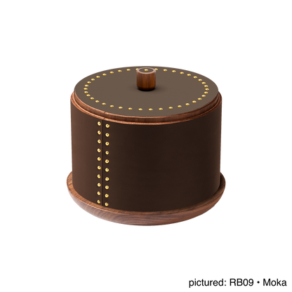 Rabitti 1969 by Giobagnara | Toiles de Noyer Walnut Wood and Saddle Leather Round Trinket Box N°1: Round trinket box in walnut wood and saddle leather with golden tacks, three sizes | Decor | 2Jour Concierge, your luxury lifestyle shop | luxury trinket box, Rabitti 1969, Toiles de Noyer, walnut wood saddle leather box, golden tack detail, Italian luxury decor, designer trinket box, Giobagnara leather box