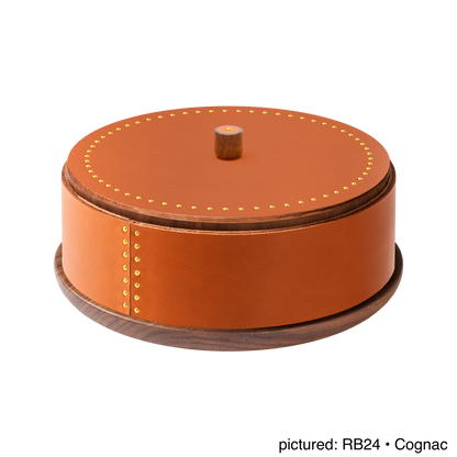 Rabitti 1969 by Giobagnara | Toiles de Noyer Walnut Wood and Saddle Leather Round Trinket Box N°1: Round trinket box in walnut wood and saddle leather with golden tacks, three sizes | Decor | 2Jour Concierge, your luxury lifestyle shop | luxury trinket box, Rabitti 1969, Toiles de Noyer, walnut wood saddle leather box, golden tack detail, Italian luxury decor, designer trinket box, Giobagnara leather box