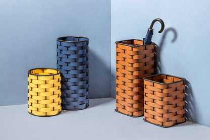 Rudi Nassa | Basket: Regenerated leather with woven structure, dark-stained aluminum frame, and smooth, matte finish, ideal for storing laundry, towels, or magazines, suitable for indoor or outdoor use | Storage / Storage Baskets & Boxes | 2Jour Concierge, your luxury lifestyle shop