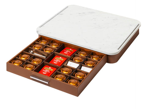 Pigment France × Gio Minelli Saint-Germain Deluxe Coffee and Tea Drawer Organizer | Leather-covered wood drawer with internal dividers and metal details, customizable in marble, Corian®, or leather top | Serveware + Hospitality / Coffee & Tea Organizers | 2Jour Concierge, your luxury lifestyle shop | luxury interiors, hospitality décor, refined lifestyle, executive interiors, boutique hotels, yacht décor, elegant living, designer home accessories