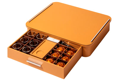 Giobagnara Saint-Germain deluxe coffee and tea drawer organizer + cups for professional capsules | Premium organizer for Nespresso professional capsules and full beverage service | Leather-covered wood structure with metal inserts in three finishes | Top customizable in leather, Corian®, or marble (classic travertine or arabescato white) | Inner walnut wood partitions hold coffee spoons, sugar, 30 capsules, 6 double-wall borosilicate glass cups, and 6 nesting rectangular saucers (all included) | Glass cups 