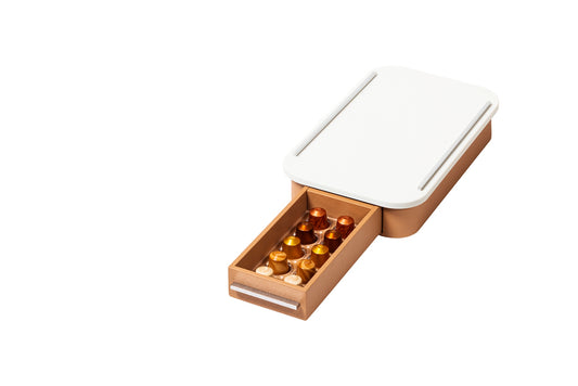 Giobagnara Saint-Germain coffee drawer organizer – corian | Compact organizer for Nespresso classic capsules | Leather-covered wood structure with metal inserts in three finishes | Top in refined Corian® for a sleek, modern look | Inner walnut wood partitions hold 10 capsules | Custom sizes available on request | Coffee accessories | 2Jour Concierge, your luxury lifestyle shop