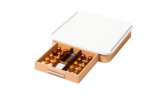 Giobagnara Saint-Germain coffee and tea drawer organizer – corian | Elegant drawer organizer for Nespresso classic capsules and tea bags | Leather-covered wood structure with metal inserts in three finishes | Top in refined Corian® for a sleek, contemporary look | Inner walnut wood partitions hold coffee spoons, sugar, 10 capsules, and tea bags | Custom sizes available on request | Coffee accessories | 2Jour Concierge, your luxury lifestyle shop
