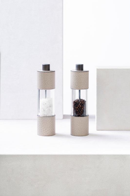Giobagnara Otello Manual Tall Salt Mill | Leather-covered stainless steel structure with a metal knob and premium ceramic grinder, providing continuous fine-to-coarse adjustment for elevated salt service | Serveware & Accessories / Kitchen Tools | 2Jour Concierge, your luxury lifestyle shop