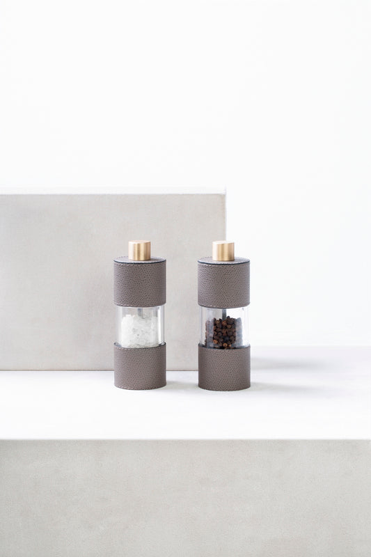 Giobagnara Otello Manual Low Salt Mill | Leather-covered stainless steel structure with a metal knob and special ceramic grinder, offering continuous adjustment from fine to coarse for precision salt grinding | Serveware & Accessories / Kitchen Tools | 2Jour Concierge, your luxury lifestyle shop