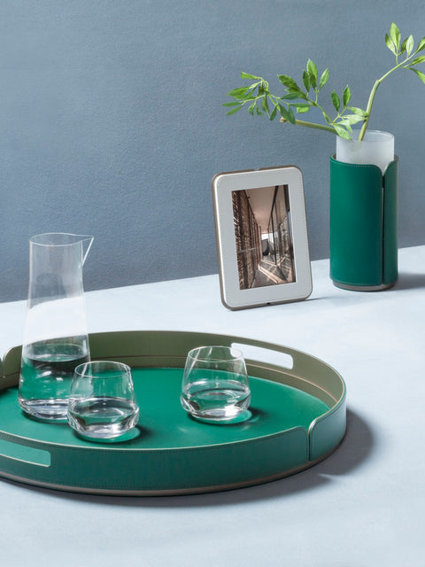 Rudi Tour | Round Tray: Regenerated leather with aluminum base and smooth, matte finish, designed by Adam D. Tihany, available in multiple sizes, suitable for serving and presentation | Serveware & Hospitality / Trays | 2Jour Concierge, your luxury lifestyle shop