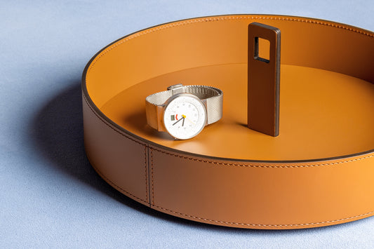 RUDI Nautilus Valet Trays Round | Inspired by submarine curves with a unique periscope-like handle for easy portability | Crafted from durable Tecnocuoio® Regenerated Leather | Combines nautical charm with essential style | Perfect for organizing essentials or serving drinks | Designed by Simone Fanciullacci | Home Decor and Accessories | 2Jour Concierge, your luxury lifestyle shop