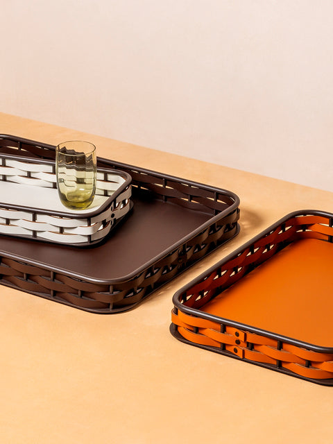 RUDI Nassa Rectangular Trays | A sophisticated blend of style and utility with a dark-stained aluminum structure | Features Tecnocuoio® weaving for contemporary elegance and durability | Available in three sizes | Home Accessories | 2Jour Concierge, your luxury lifestyle shop